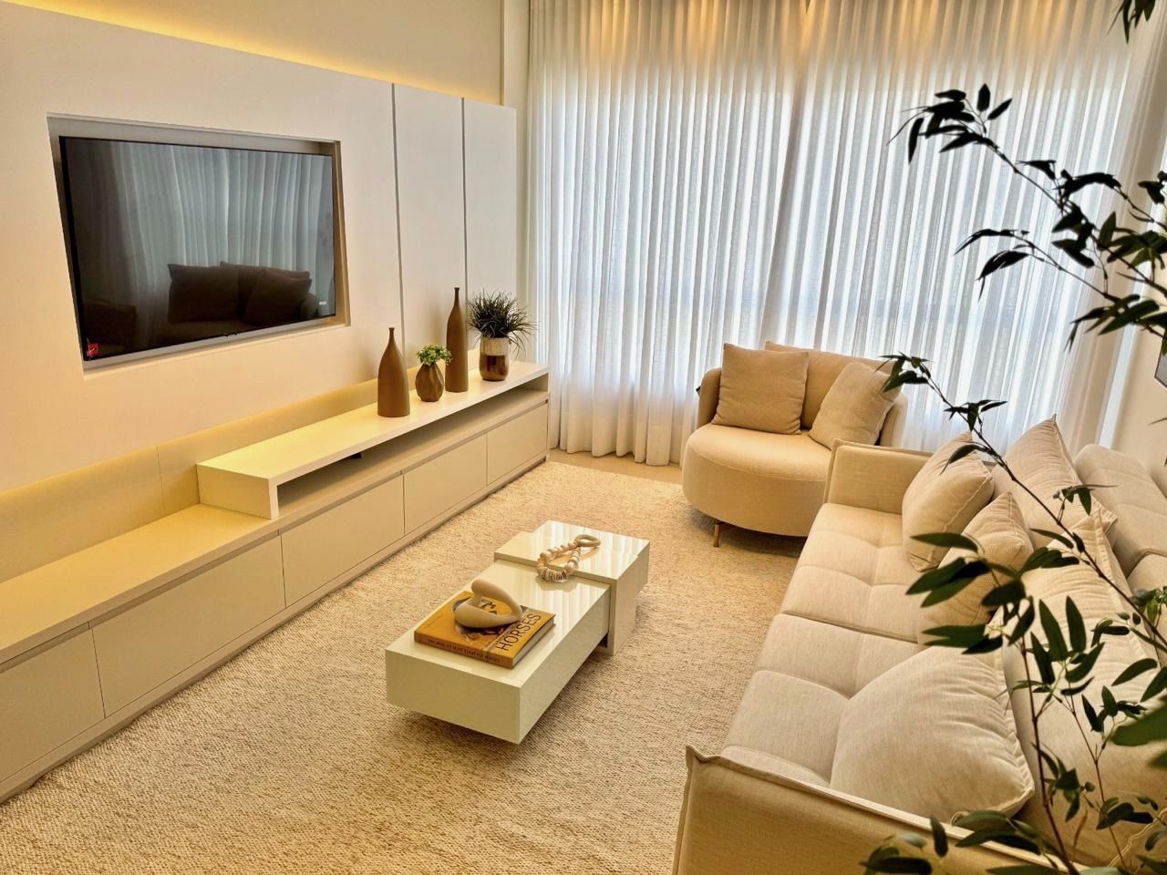 Sala de estar do apartamento em Capão da Canoa